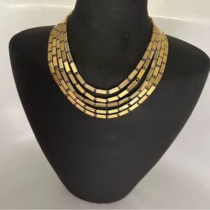 Vintage 1970s gold tone multi strand necklace.